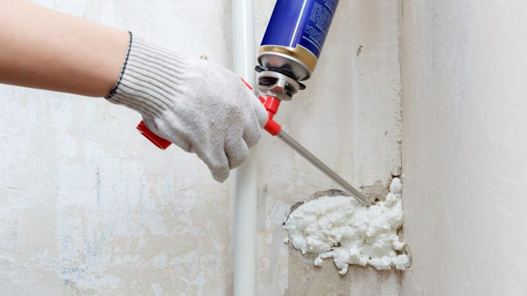 Polyurethane foam applied to fill gap in wall